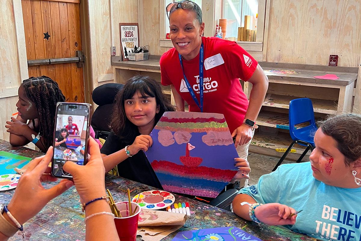 Helping kids paint at MDA event.