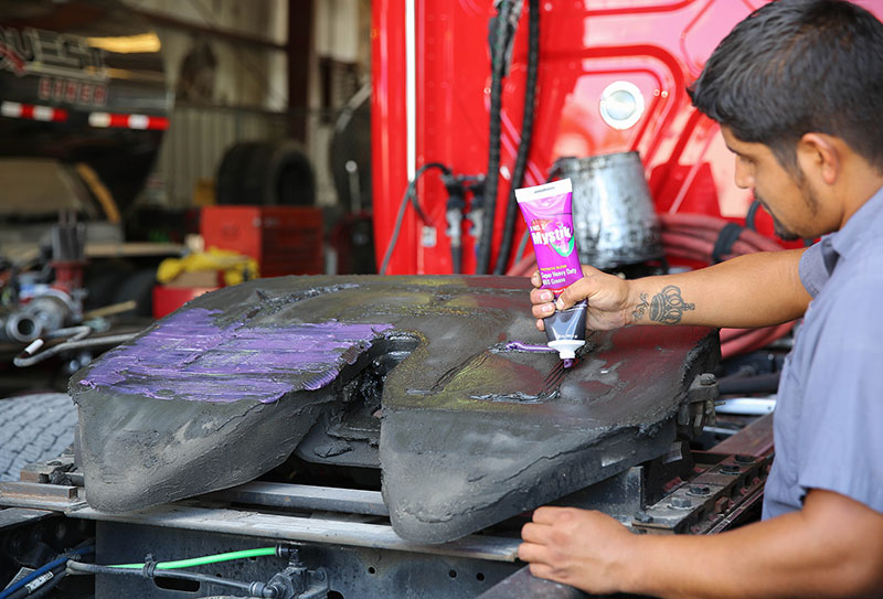 Worker applying lubes